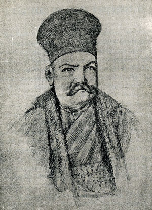 Σταματ�λος Αντωνόπουλος με τη χαρακτηριστική ενδυμασία των προυχόντων. Φοράει τζουμπ� και στο κεφάλι σφαιροειδ�ς κάλυμμα.