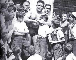 Jim Londos showing a move to his young fans