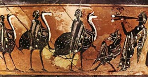 Παράσταση χορού νέων αντρών, οι οποίοι ιππεύουν στρουθοκάμηλους, σε μελανόμορφο σκύφο του 6ου αιώνα π.Χ. Δεξιά άντρας παίζει δίαυλο, ενώ μπροστά του η μικρή μορφή του Πανός υποδέχεται το χορό. Boston, Museum of Fine Arts.